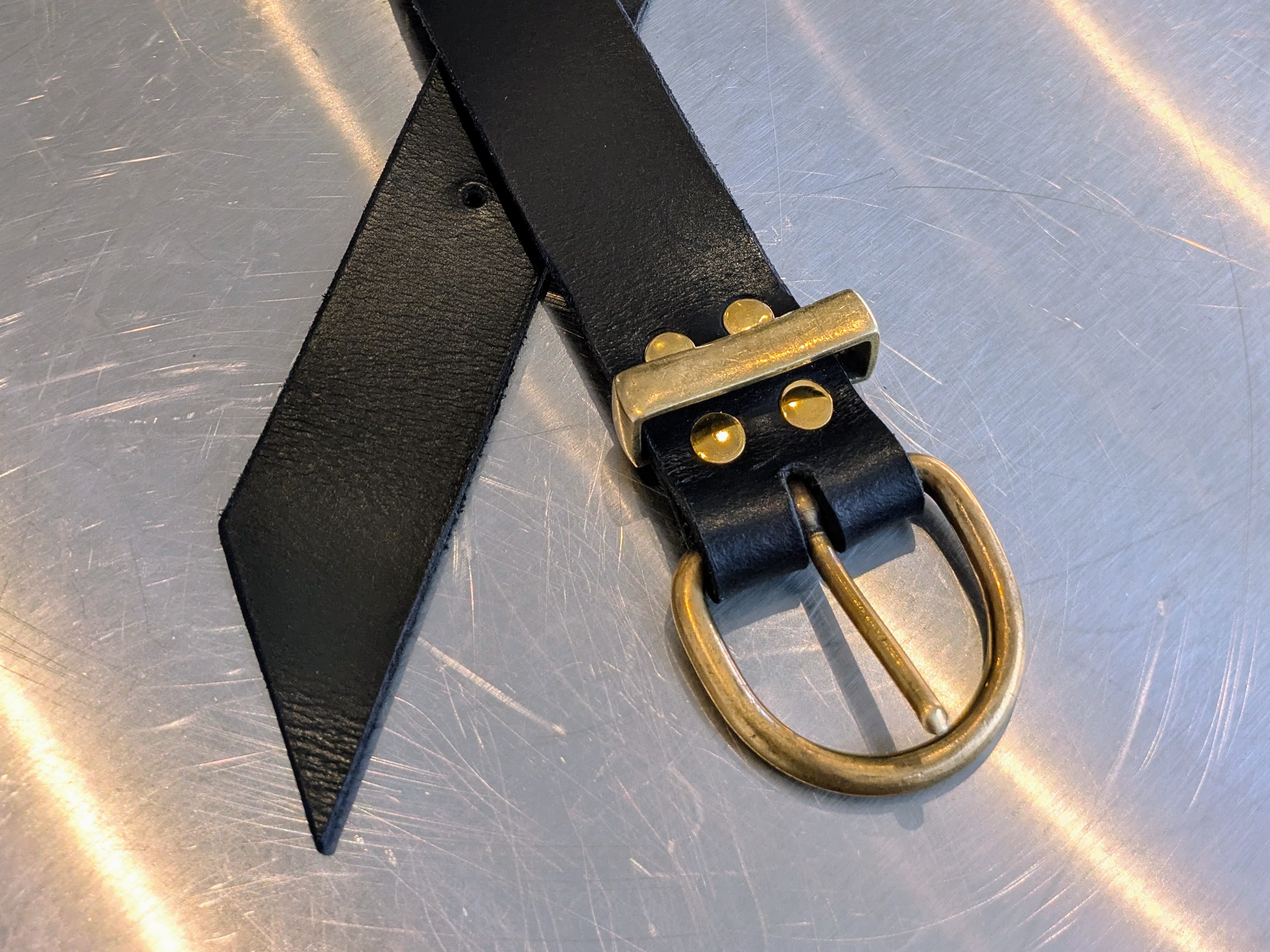 Black belt with brass hardware.