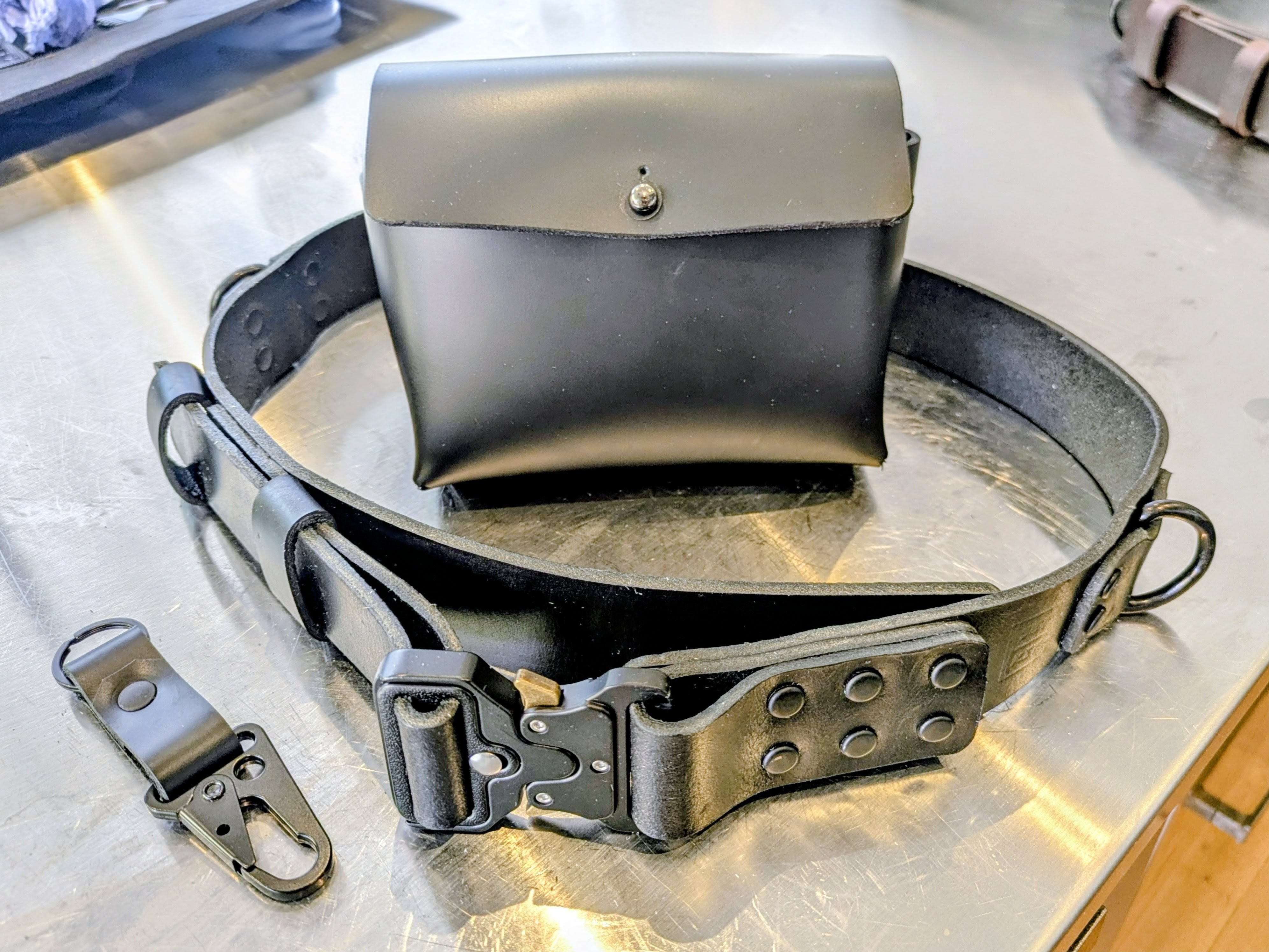 Black leather belt and accessory set.