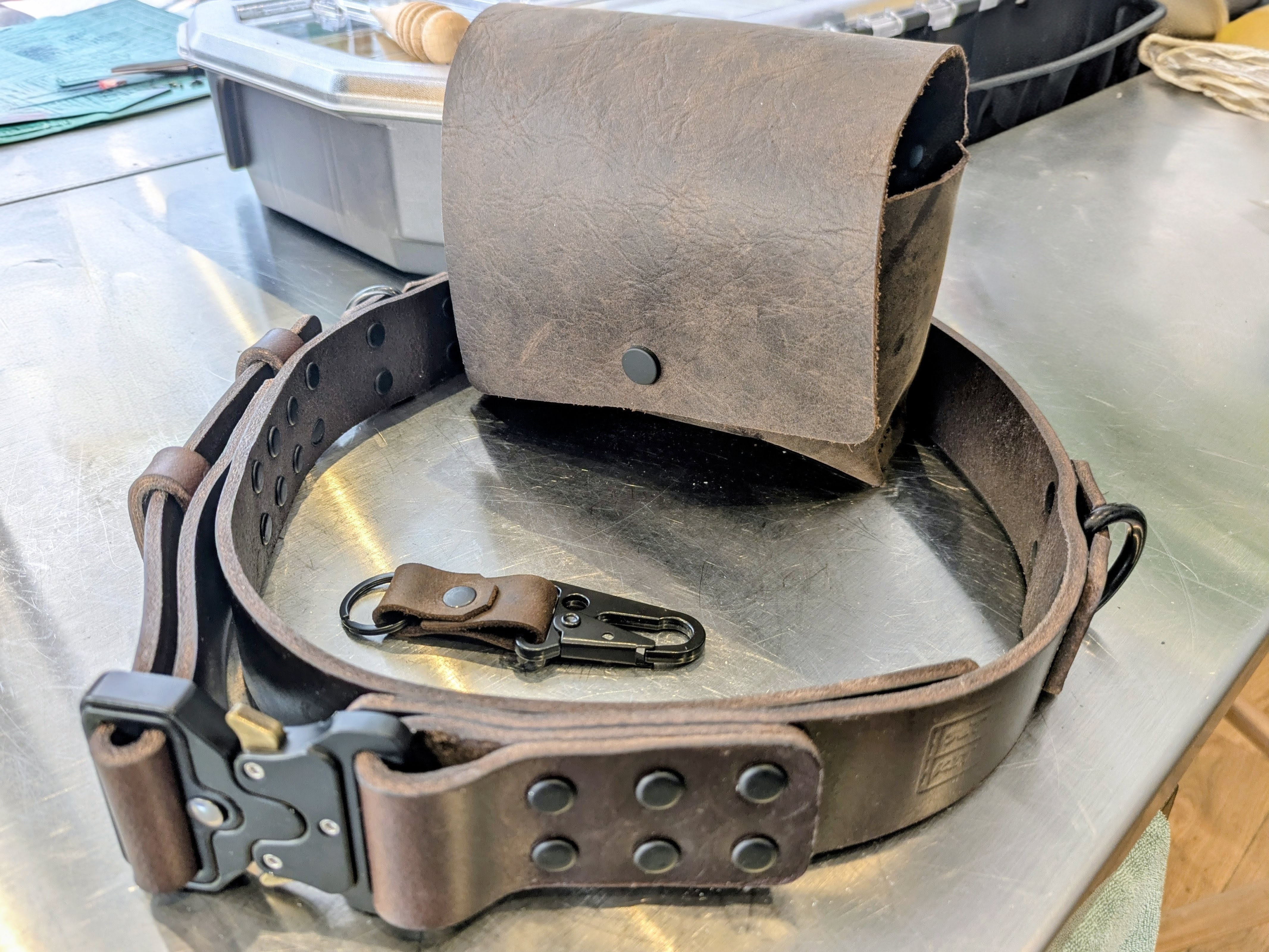 Belt, pouch and key fob for assistant director in distressed truffle.